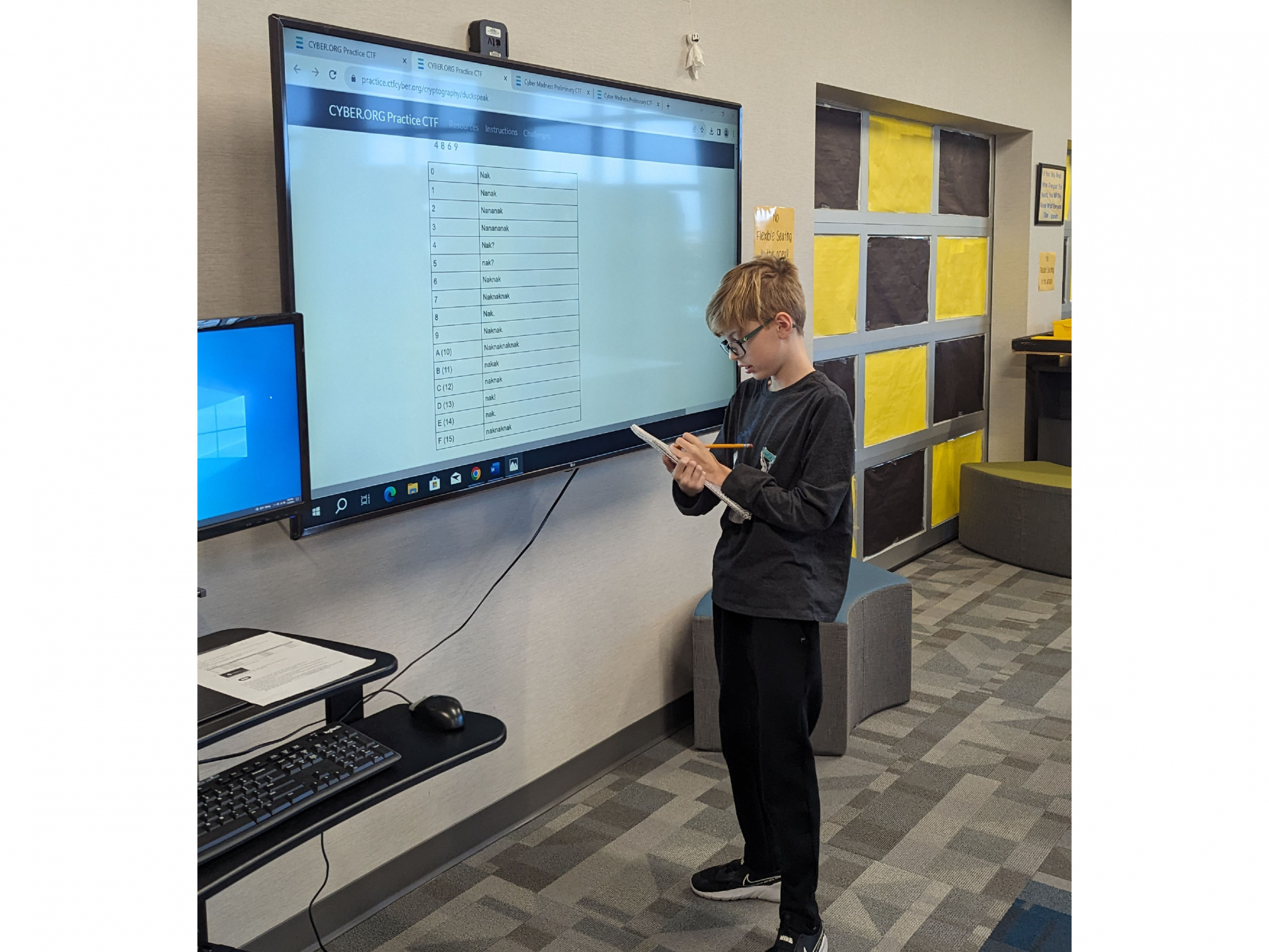 student working on one of the cyber challenges