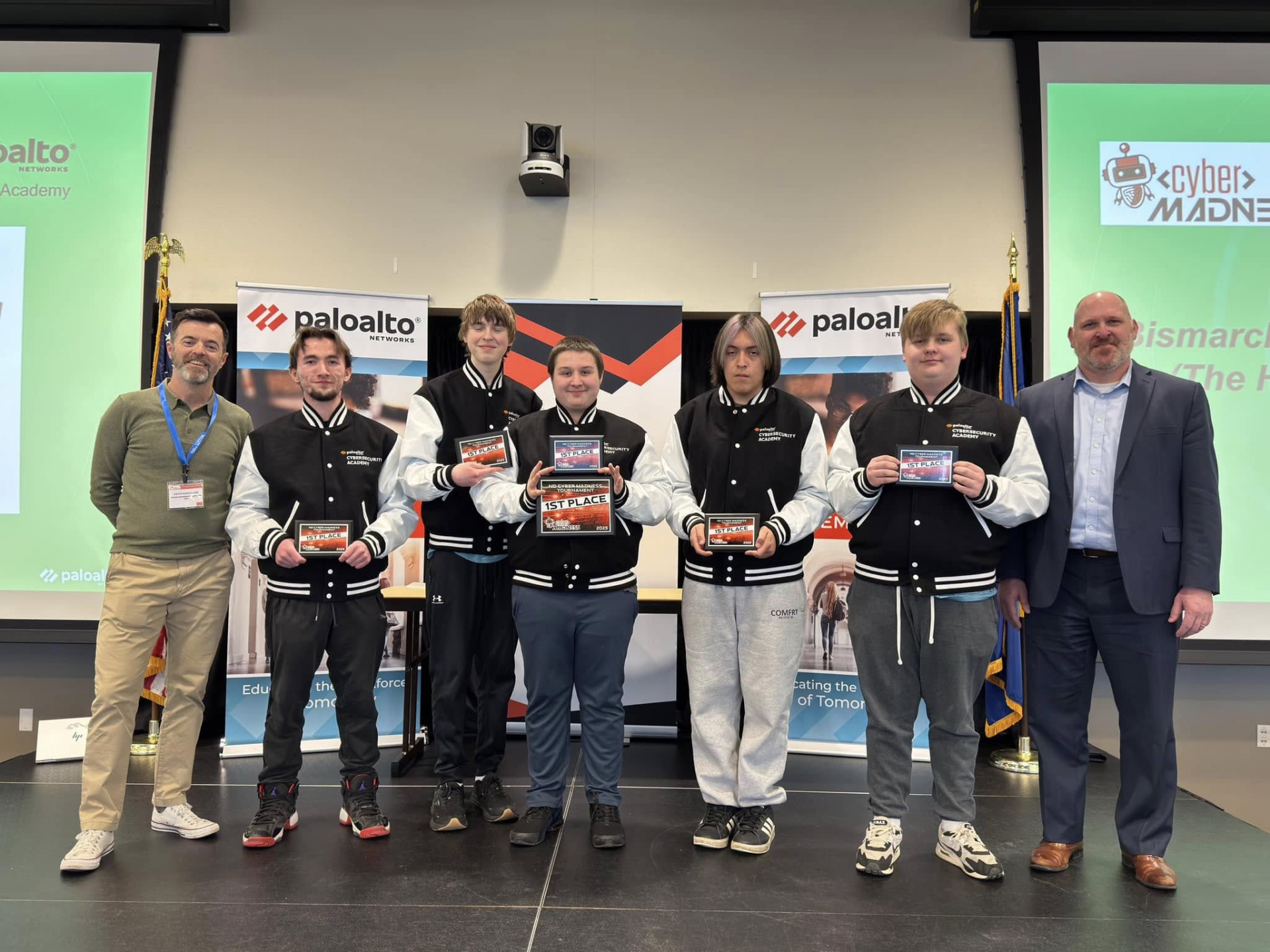 Bismarck High School team who won first place, posing for a photo with their awards