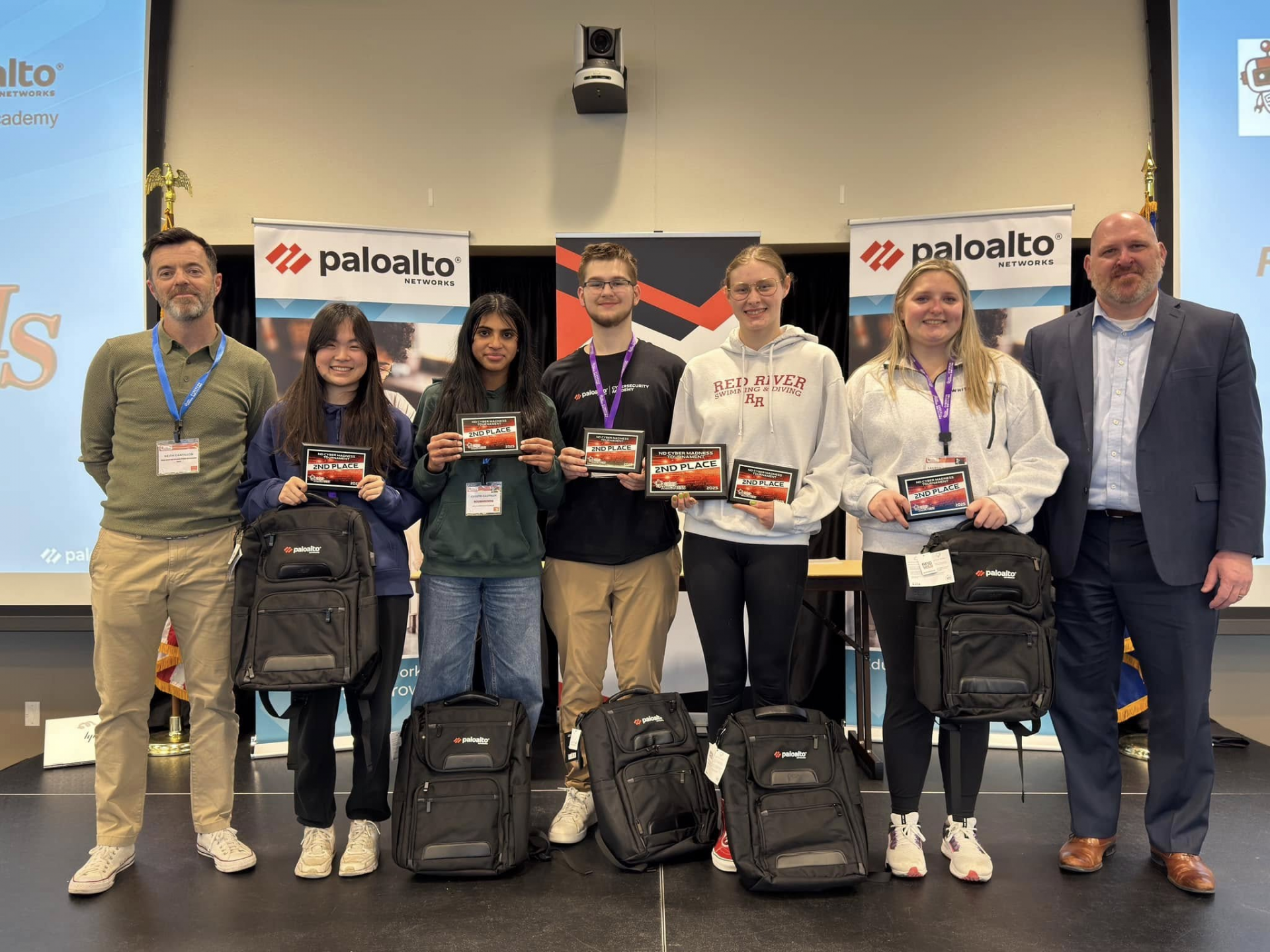 Grand Forks Red River High School team who won second place, posing for a photo with their awards