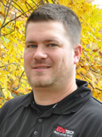 Middle aged man wearing a black shirt.