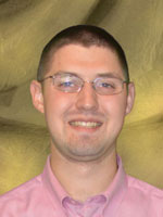 Young man wearing a red shirt.